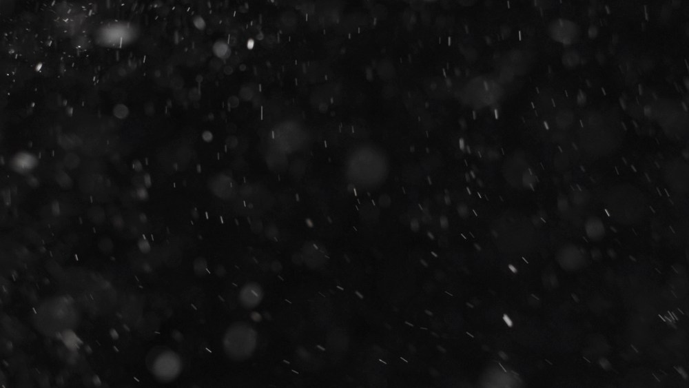 Пылинки на черном фоне